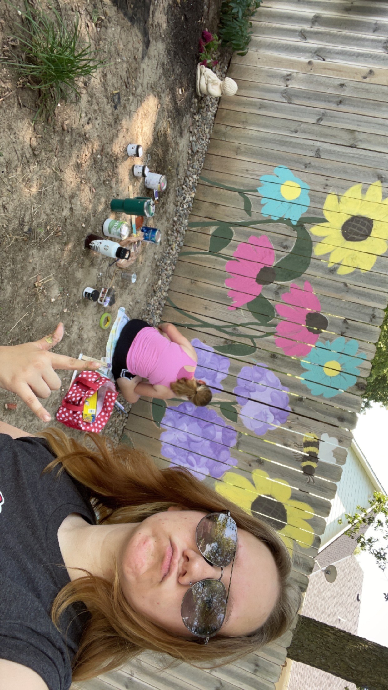 me and my friend at our mural.